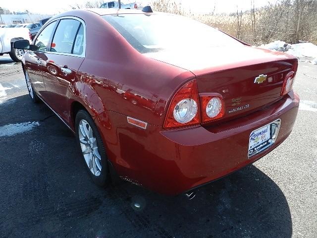 Chevrolet Malibu 2010 Kia SX Sedan
